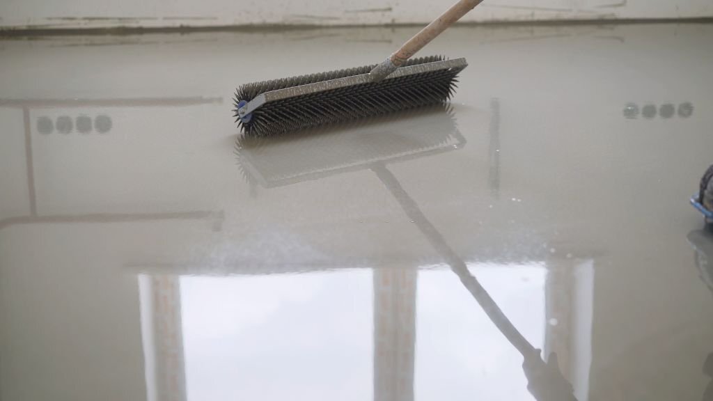 Concrete polishing process showcasing professional techniques for a smooth and shiny surface