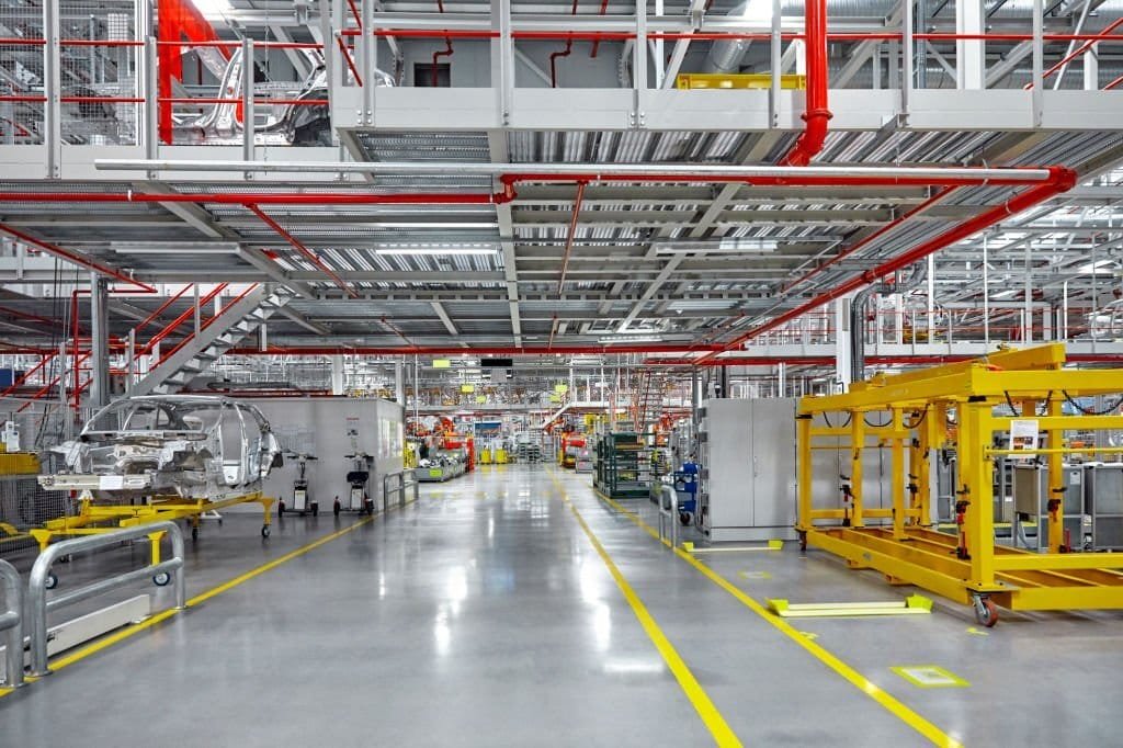 Automotive manufacturing assembly floor with marked aisles and production equipment