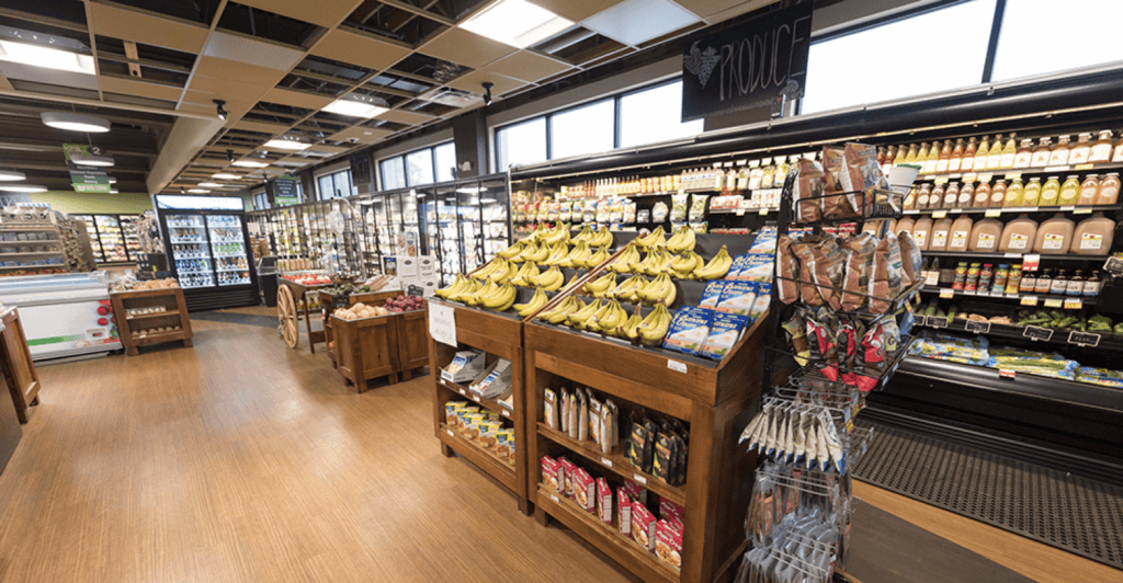 Produce displays, refrigerated cases and customer aisles in a grocery store