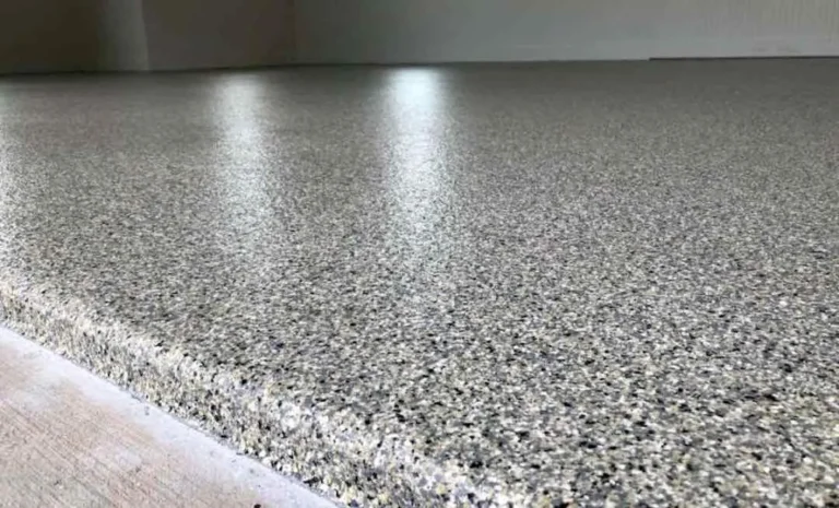 Black, white and grey decorative flake floor with reflected overhead lights