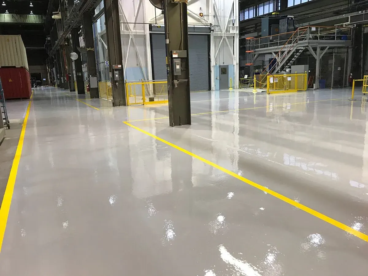Industrial warehouse epoxy flooring with safety lines in Vancouver, BC