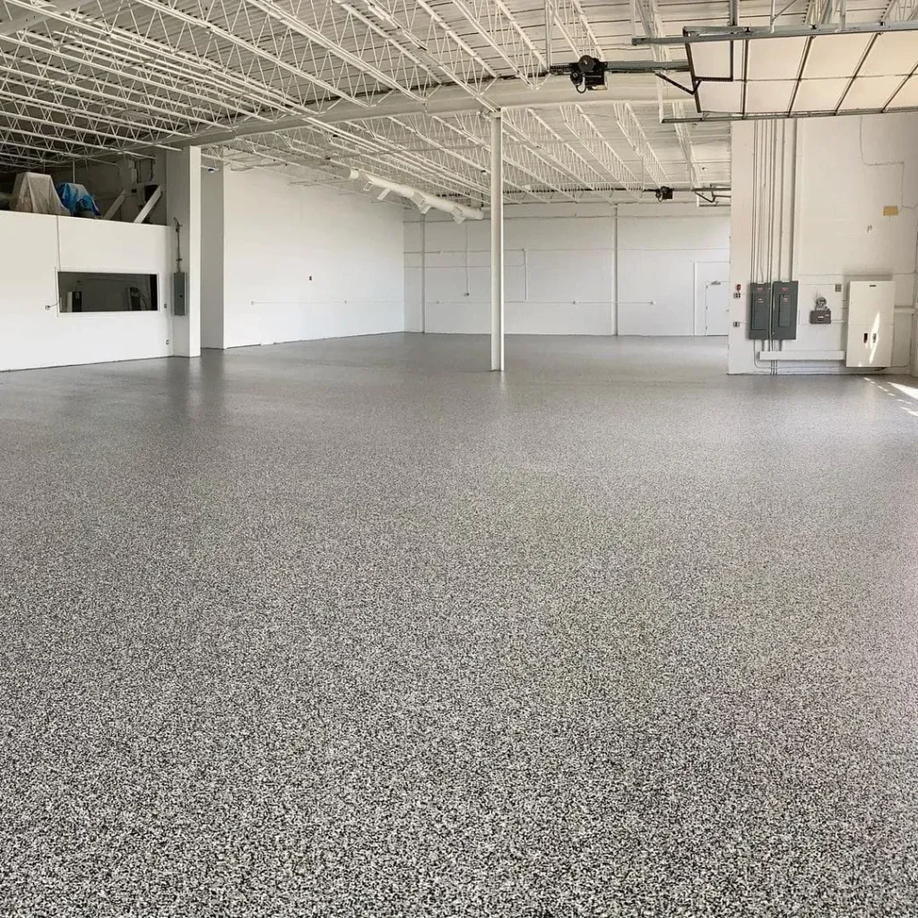 Decorative flake resin floor across an open commercial interior