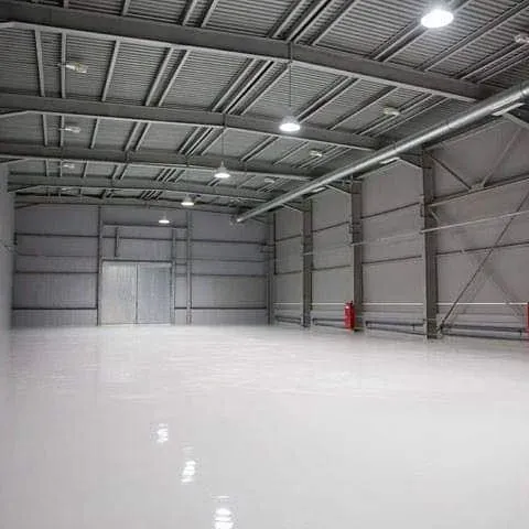White industrial epoxy flooring warehouse interior