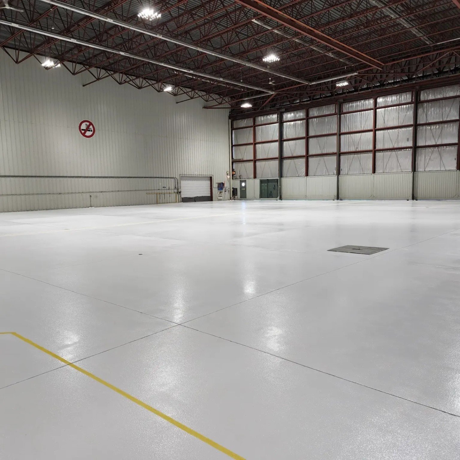 Completed aircraft hangar epoxy flooring at Million Air YVR Airport