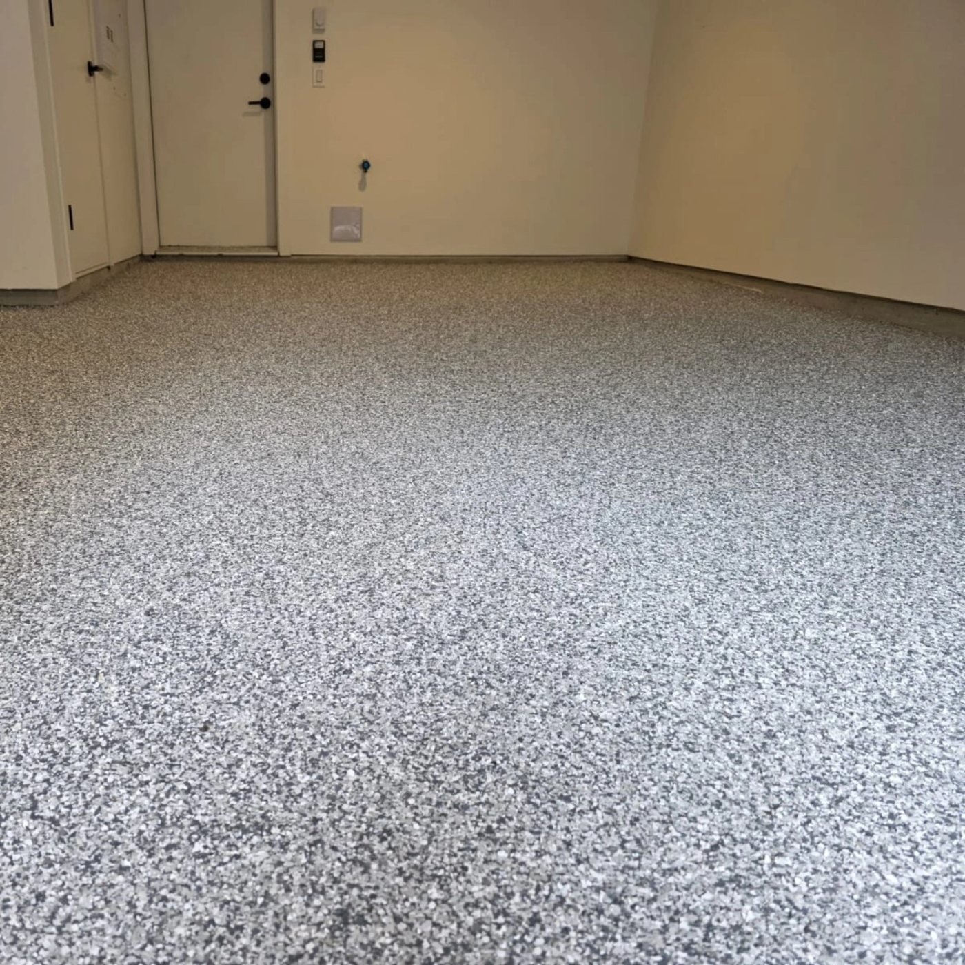 Completed decorative flake garage floor by Priority One Epoxy Flooring in Squamish BC