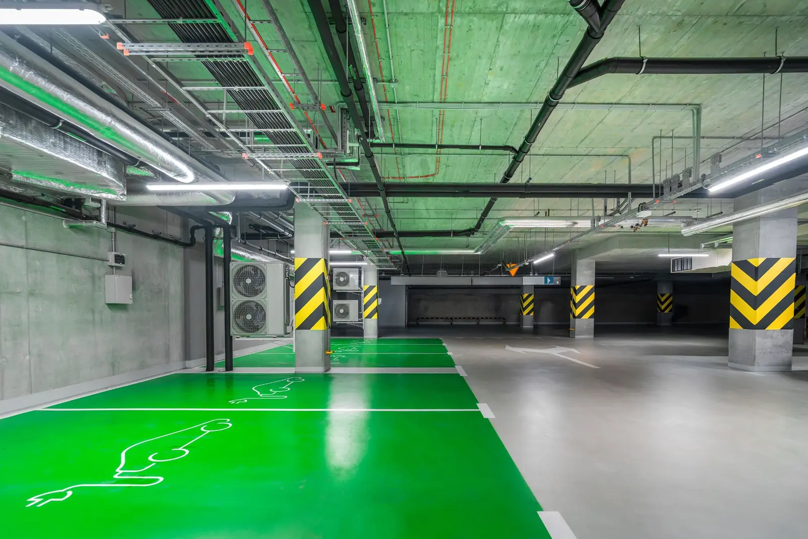 Accessible parking spaces finished with green traffic deck coating