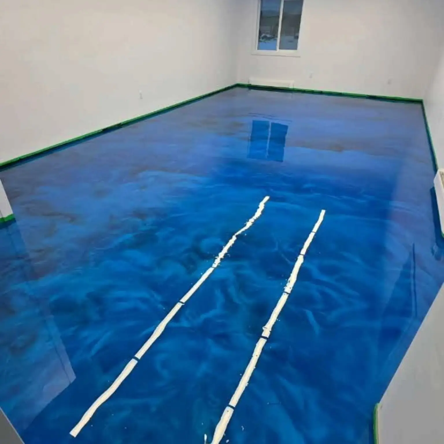 Blue metallic epoxy feature floor with layered colour movement