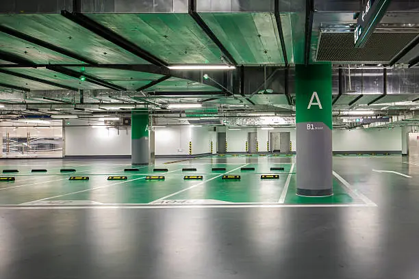 Commercial parkade floor membrane with green parking zones