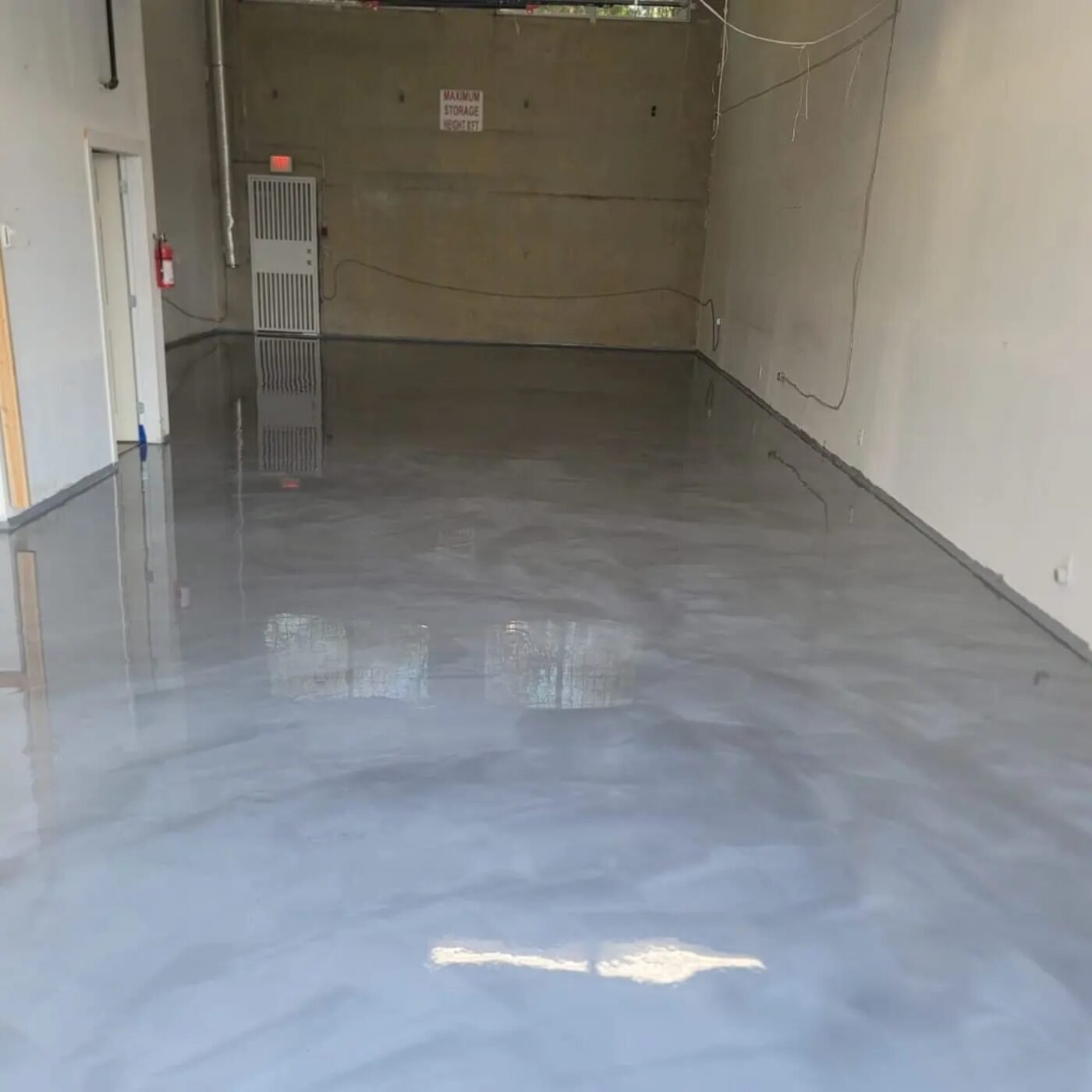 Completed grey commercial resin floor in a Burnaby BC unit