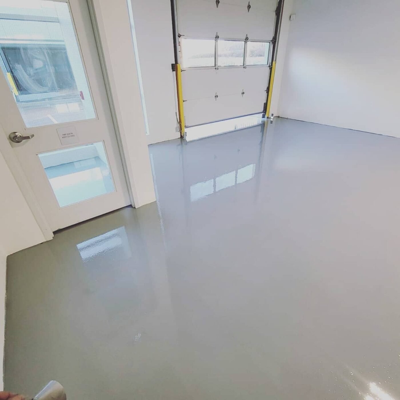Completed solid-grey resin garage floor in Burnaby BC