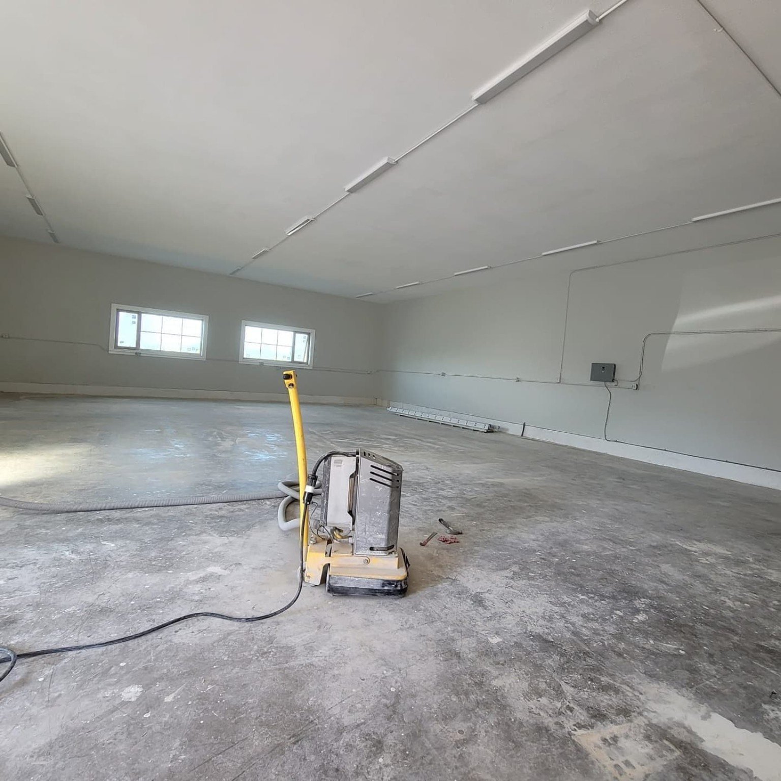 Diamond grinding concrete before a resin floor installation in Richmond BC