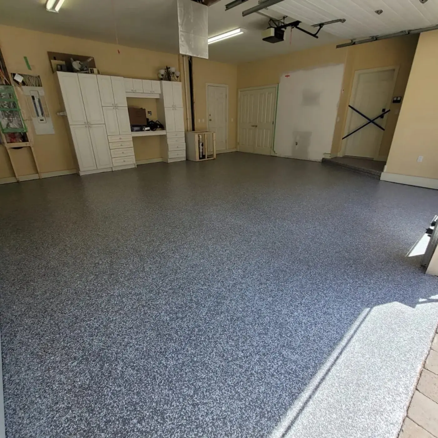 West Vancouver residential garage with decorative epoxy flake flooring