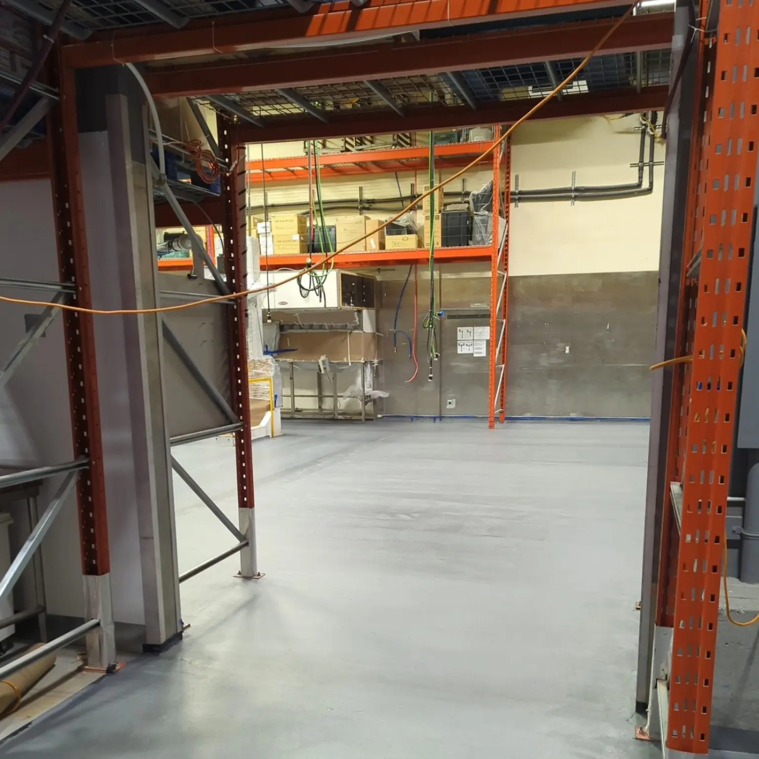 Completed grey urethane cement floor in a Marpole industrial space