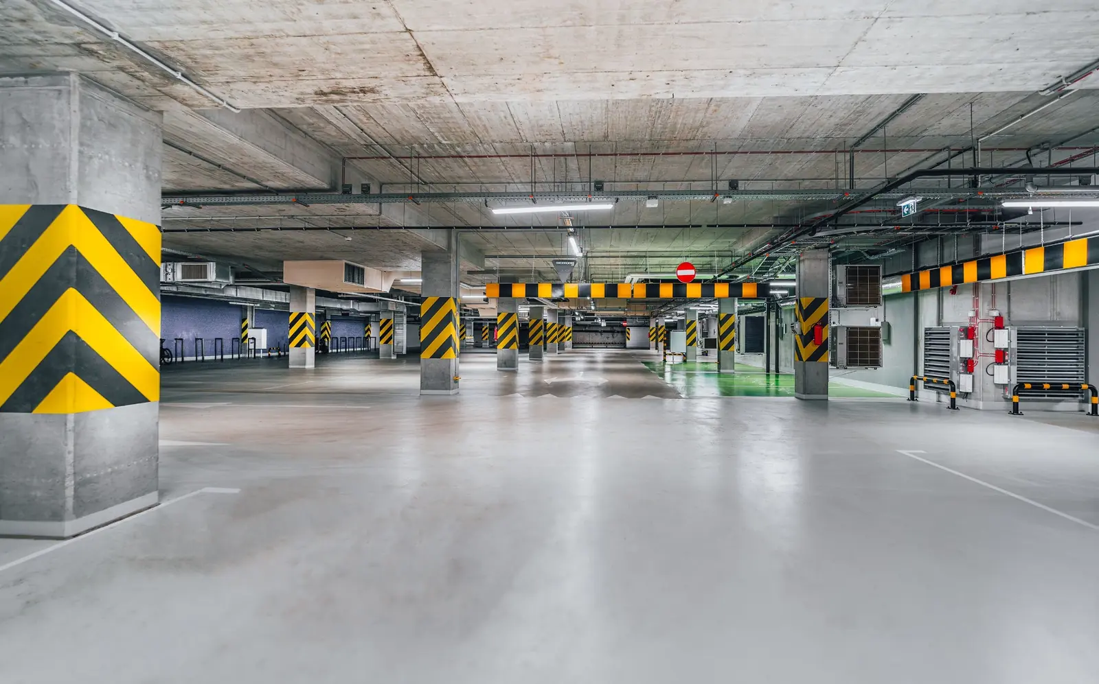 Large underground parkade with coated concrete traffic deck
