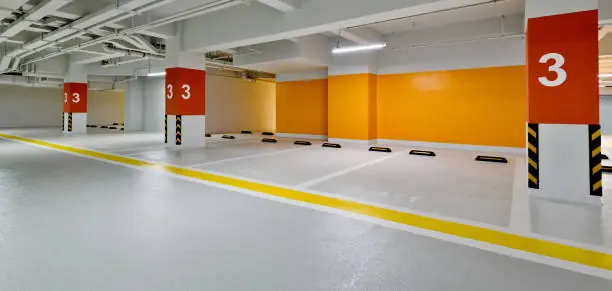 Light grey parkade membrane with yellow traffic lane markings