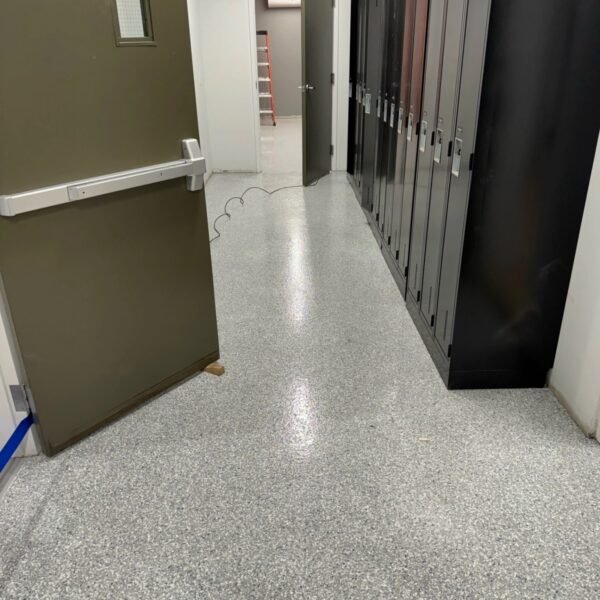 Finished flake floor between lockers and employee facilities