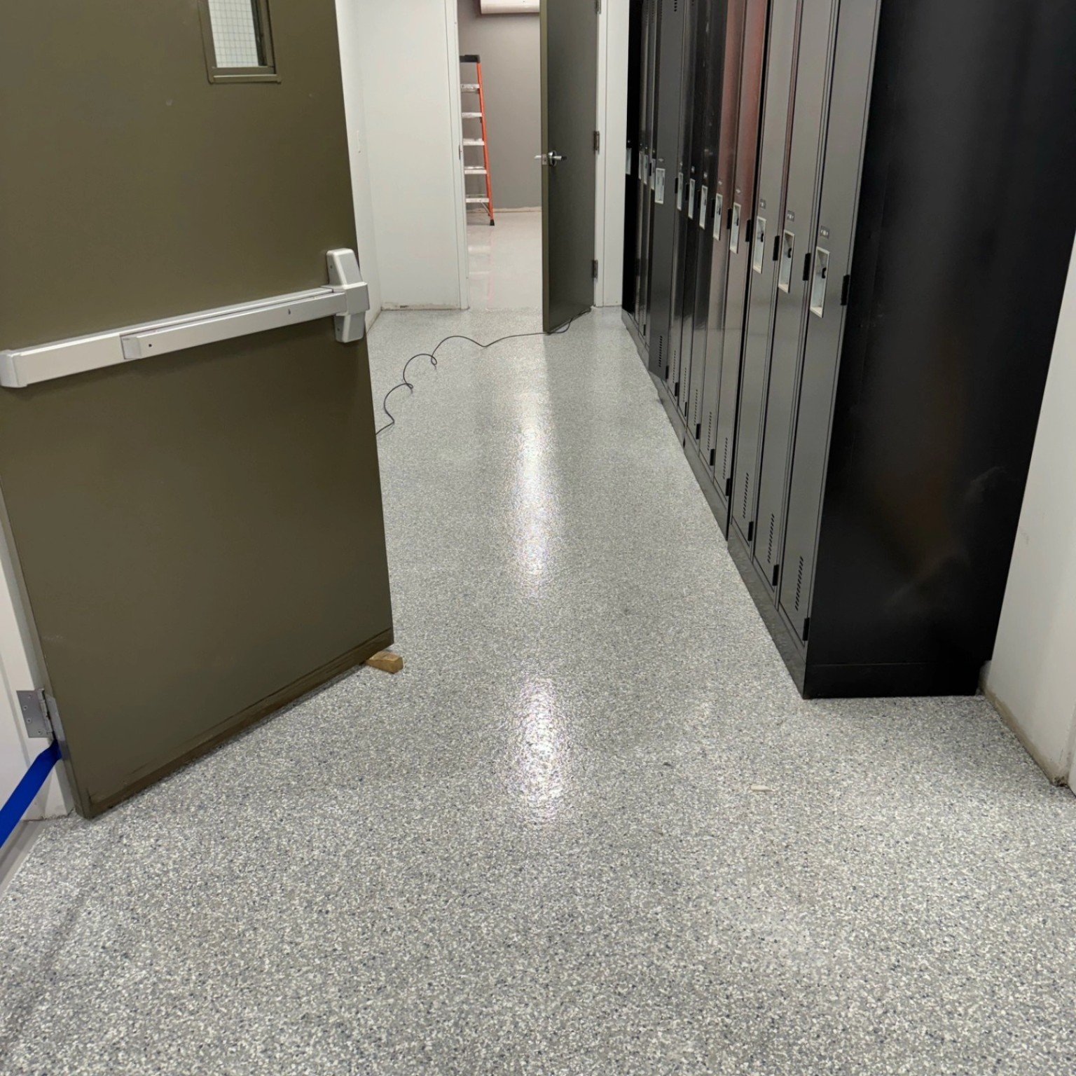 Flake flooring in locker area at Liebherr industrial facility Abbotsford