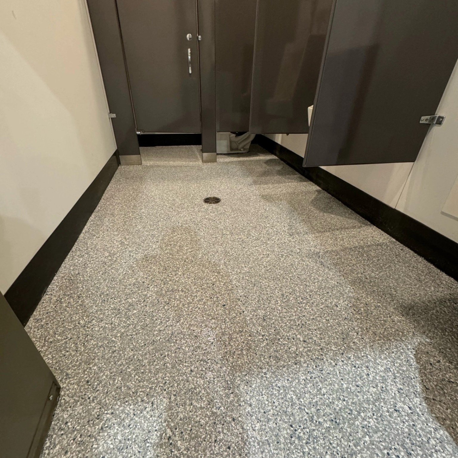 Flake resin flooring in restroom at Liebherr Abbotsford project