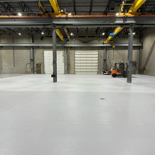 Completed solid-colour warehouse floor at Priority One's Liebherr project in Abbotsford