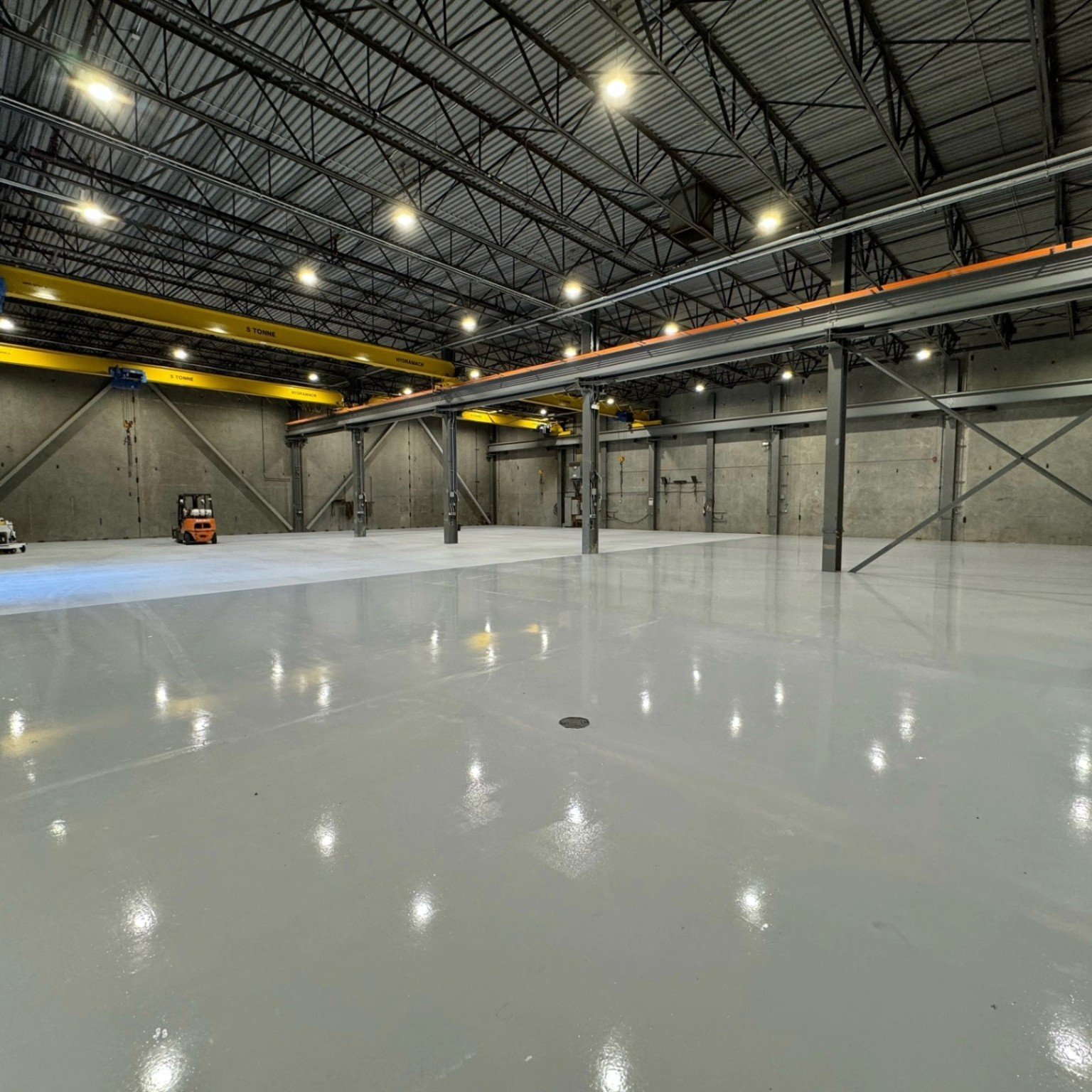 Wide view of Liebherr warehouse epoxy flooring in Abbotsford British Columbia