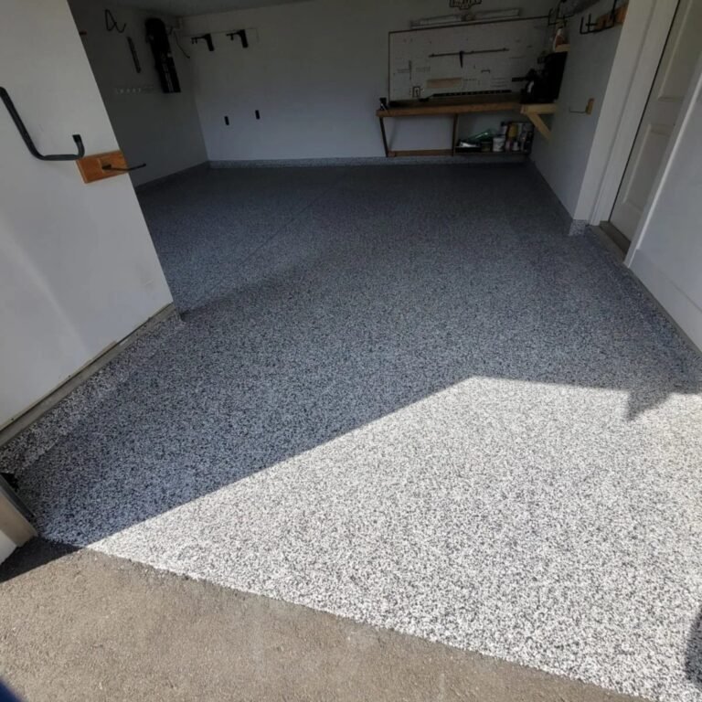Full-flake garage floor in West Kelowna viewed from the vehicle entrance
