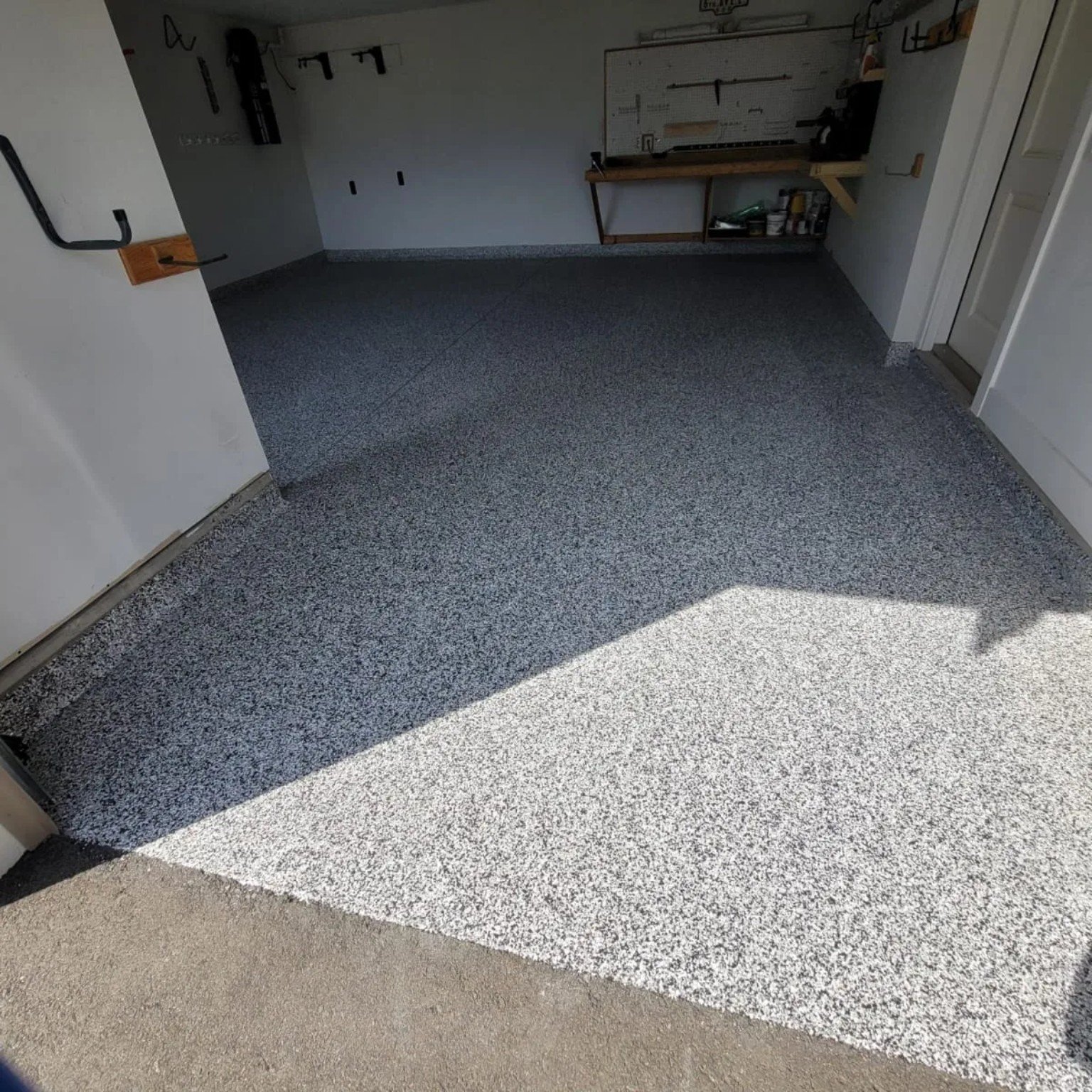 Full flake garage floor installed by Priority One Epoxy Flooring in West Kelowna BC